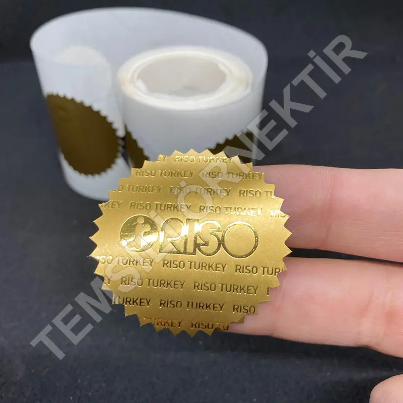 Etiket Baskı 90 Gr. Kuşe Çıkartma Tek Yön Renkli Parlak Selefonlu Altın Yaldız
